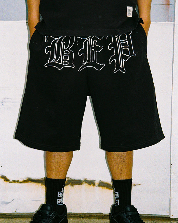 3 LETTER OE SWEAT BAGGY SHORTS BLACK
