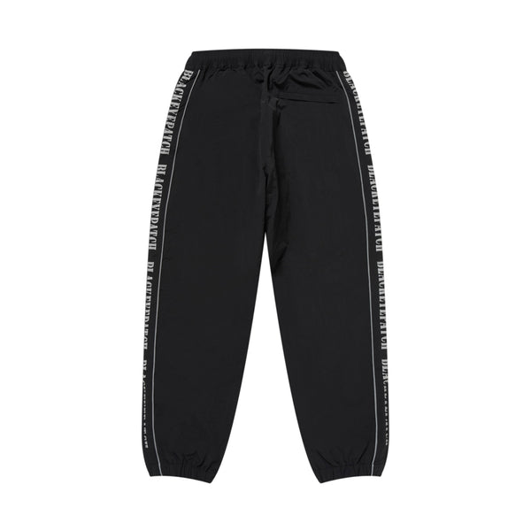 REFLECTIVE STENCIL LOGO TRACK PANTS BLACK