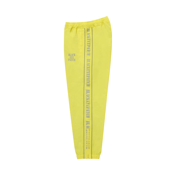 REFLECTIVE STENCIL LOGO TRACK PANTS YELLOW