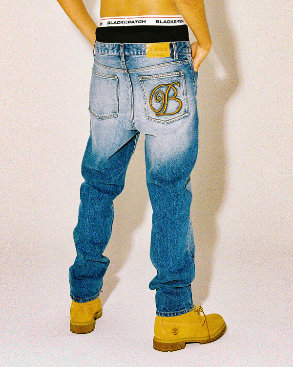 B EMBLEM SLIM FIT JEANS INDIGO