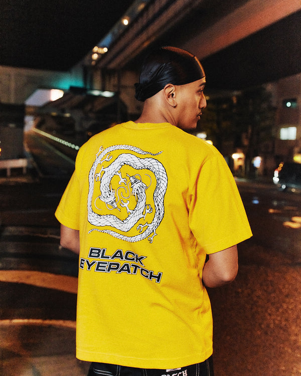 REFLECTIVE DRAGON SWIRL LOGO TEE MUSTARD