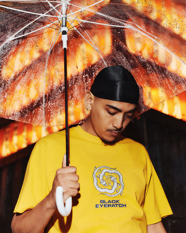 REFLECTIVE DRAGON SWIRL LOGO TEE MUSTARD