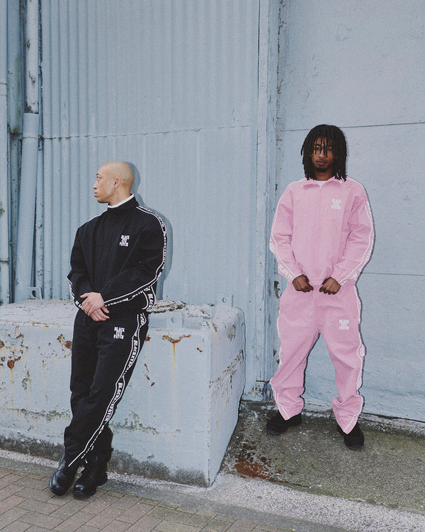 REFLECTIVE STENCIL LOGO TRACK PANTS BLACK